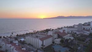 an aerial view of the beach at sunset at Occidental Nuevo Vallarta - All Inclusive in Nuevo Vallarta