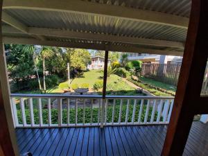 a view from the front porch of a house at Sunrise Guesthouse in Greytown +2 photos