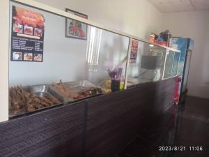 a buffet line with food in a restaurant at Crown Dove in Benin City