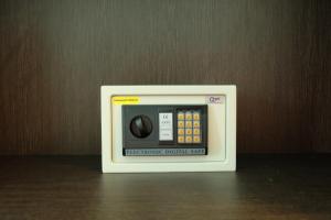 a small electronic device sitting on top of a table at A Plus Deluxe Hotel in Ko Lipe