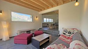 a living room with a couch and a table at Chalet - Magnifique chalet d'architecte 10 pers MAE-2774 in Les Prés