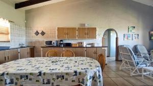 a kitchen with a table and chairs in a room at Allesreg Chalet B2 in Margate