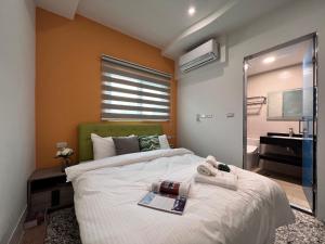 a bedroom with a large bed and a bathroom at Aren Inn in Zhushan +7 photos