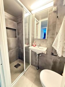 a bathroom with a shower and a sink at Haven Home in Stavanger