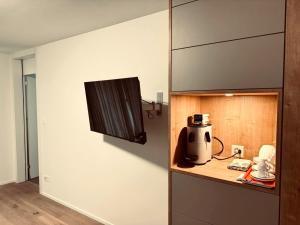 a kitchen with a counter with a appliance on it at Comfort Rooms mit Whirlpoolzugang in Romanshorn
