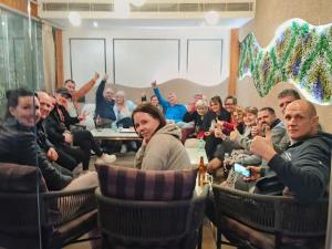 a group of people sitting in chairs in a room at Hotel Gold The Royal A Luxurious Stay- Near New Delhi Railway Station & Connaught Place in New Delhi