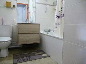 a bathroom with a toilet and a tub and a sink at Résidence Lienz - Studio cabine avec terrasse exposï¿½e Sud MAE-8324 in Barèges