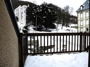 a balcony with snow on a fence and buildings at Résidence Lienz - Studio cabine avec terrasse exposï¿½e Sud MAE-8324 in Barèges