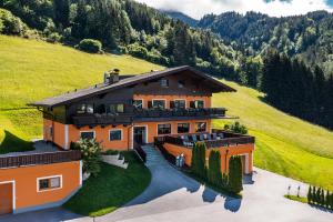 an aerial view of a house in the mountains at Der Burgblick-Adults Only 24 H Self Check In in Werfen