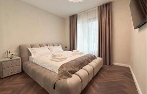 a large bed in a room with a window at Lovely Apartment In Rovinj in Rovinj