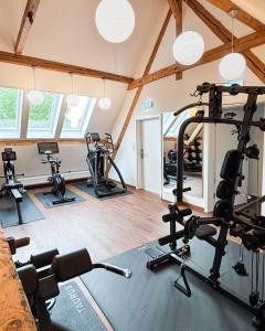 a gym with several exercise bikes in a room at Hotel zur Isar in Plattling