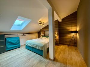 a bedroom with a bed and a skylight at ANPELA in Rýmařov