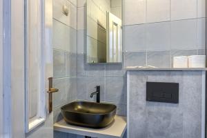 a bathroom with a sink and a mirror at Martin's B&B in Dramalj +17 photos