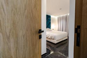 a door leading to a bedroom with a bed at Villa panorama Marrakech in Marrakesh