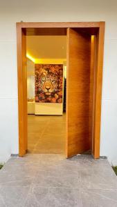 an open door of a building with a painting on the wall at Villa panorama Marrakech in Marrakesh