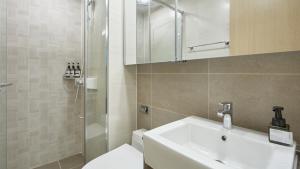 a bathroom with a sink and a shower and a toilet at Haeon stay haeundae in Ch'ŏngsap'o +34 photos