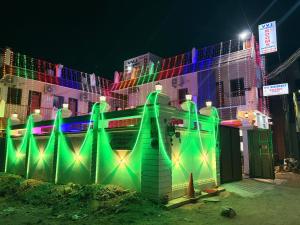 a building decorated with christmas lights in front of it at Gravity Groups VVJ - Near Jipmer Sangamithra in Pondicherry +8 photos