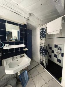 a bathroom with a sink and a toilet at Résidence 740-pleneuf Val Andre - Belle maison en pierre offrant de beaux volumes à 2km dans la de Pleneuf Val André MAE-8554 in Pléneuf-Val-André