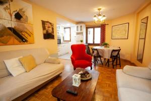 a living room with a couch and a table at Casa Celia by CARDI SUITES in Panticosa
