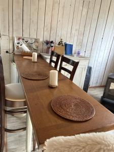 a wooden table with two plates on top of it at Le chalet du Rêveur in La Gaude +24 photos