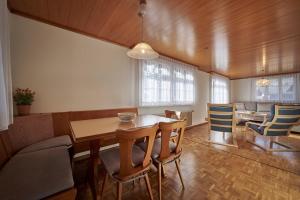 a dining room with a table and chairs at Cozy traditional Chalet, Stunning Mountain Views in Grindelwald