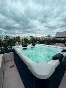 a bath tub sitting on top of a building at O!live Fully Equipped Apartments with Unique Design in Athens