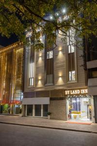 a store front of a building at night at Hotel Byland Inn- Near Connaught Place And 5 Minutes From New Delhi Station in New Delhi