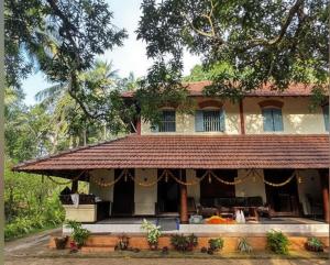 an old house in the middle of a forest at Kakkakuni heritage in Kozhikode