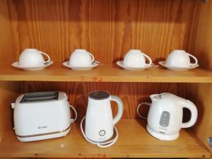 two toasters and a toaster on a shelf at Gemenc - Lak in Baja