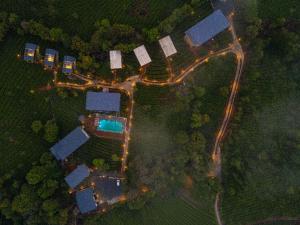 an overhead view of a house with lights at The Hosteller Bam Vagamon in Vagamon