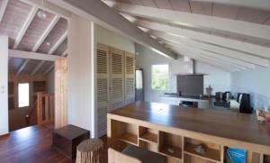 a kitchen with a wooden counter in a room at Bidart centre maison vue mer in Bidart