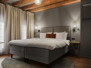 a bedroom with a large bed and a window at Ad Astra by Elite - Hotel, Spa & Resort in Södertälje +120 photos