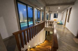 a staircase in a house with a view of the ocean at Stonewater Beach Villa, Negombo in Mahawatta