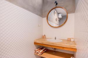 a bathroom with a sink and a mirror at Cozy villa 2bdr in Seminyak , pool,800m beach in Seminyak +19 photos