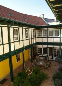 an outside view of a building with a patio at Frühstückshotel Jammernegg in Köflach