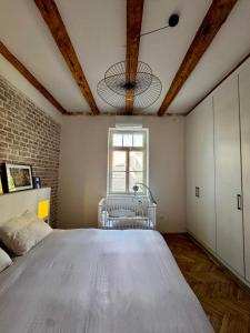 a bedroom with a large bed and a window at Exceptional Home-5 min from Porto Montenegro Tivat in Tivat