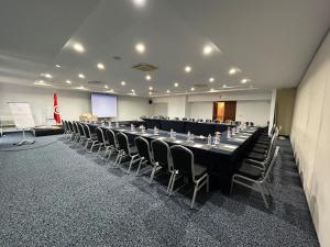a large conference room with a long table and chairs at El Mouradi Gammarth in Gammarth +51 photos