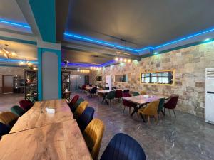 a dining room with wooden tables and chairs at Kompleks Koral Konak in Prezhda +31 photos