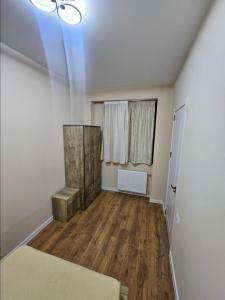 an empty room with a bed and a window at Tbilisi- Georgia in Tbilisi City