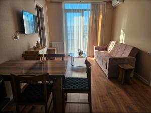 a living room with a couch and a table at Tbilisi- Georgia in Tbilisi City