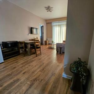a living room with a table and a dining room at Tbilisi- Georgia in Tbilisi City