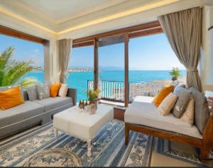 a living room with a view of the ocean at GM Hotel in Argao