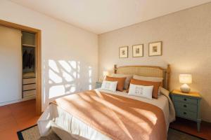a bedroom with a large bed with two pillows at Casas da Memória in Tarouca +144 photos