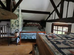 a bedroom with two beds in a room with wooden ceilings at LA GRANDE JAOUGUE in Callen +102 photos