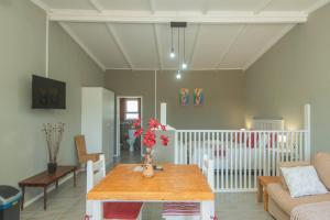 a living room with a table and a couch at Accommodation on 3329 - Unit 3 in Gqeberha
