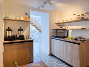 a kitchen with wooden cabinets and a counter top at Heilotel in Heilbad Heiligenstadt