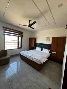 a bedroom with a bed and a ceiling at Hotel HB Grand in Anūpgarh