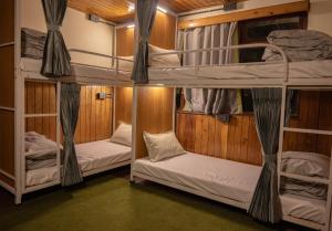 a bunk bed room with two bunk beds at Trippers CastleWoods in Darjeeling