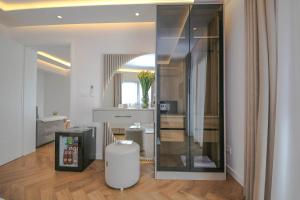 a living room with a mirror and a table at Murati Lake View Hotel in Tirana +102 photos
