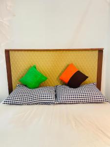 two pillows sitting on top of a bed at Pap De Home in Weligama